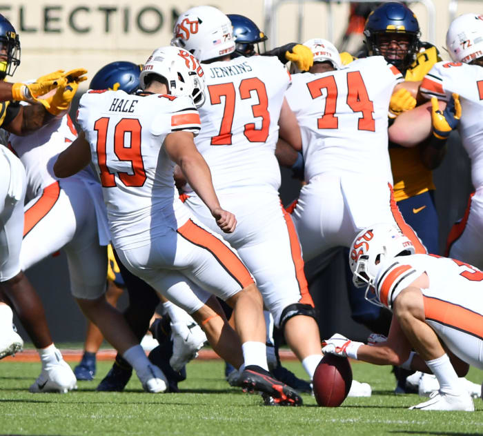 Alex Hale (19) kicking and Jake McClure holding against West Virginia earlier this season.
